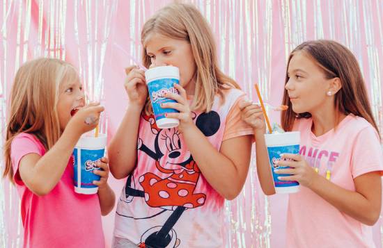 Three girls eating shaved ice